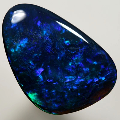 SOLID BLACK OPAL Gem quality opal. Bright strong peacock fire in a Flame pattern SEE VIDEO